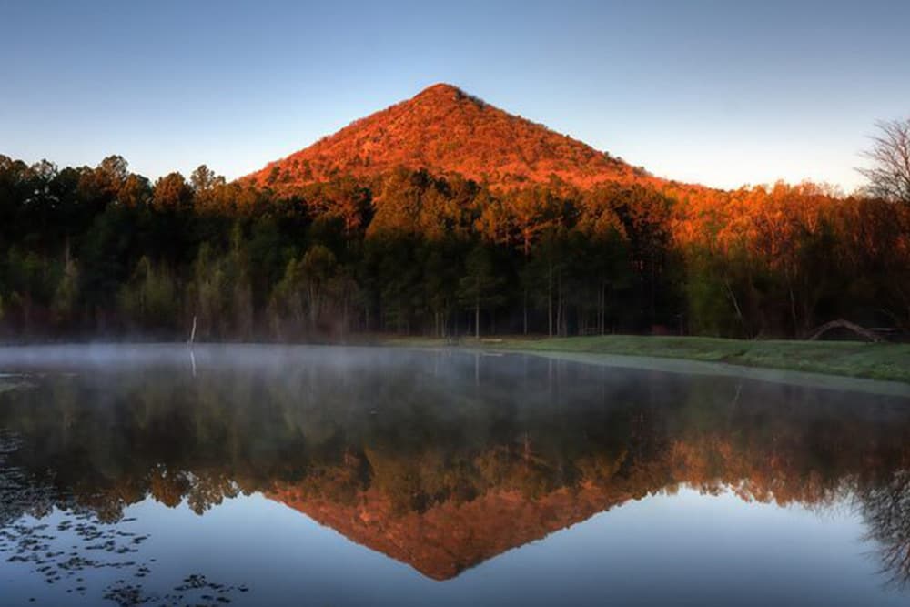 Majestic mountain peak reflecting in a still lake.